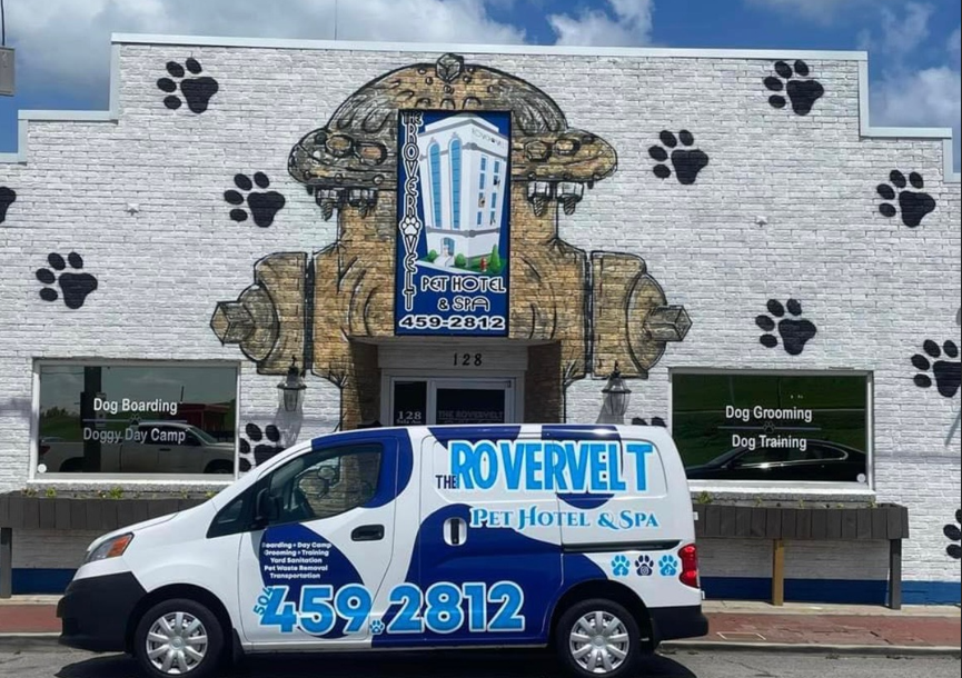 The Rovervelt Pet Hotel and Spa storefront with company van